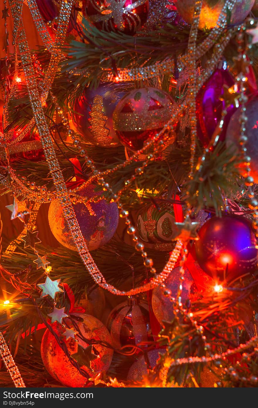 Decorated Christmas tree and colorful garland lights. Decorated Christmas tree and colorful garland lights.