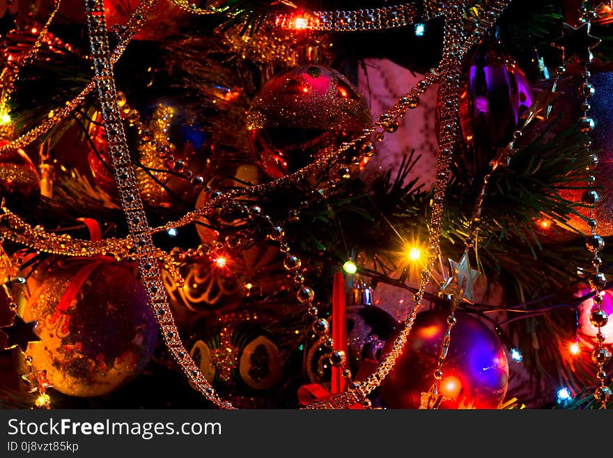 Decorated Christmas tree and colorful garland lights. Decorated Christmas tree and colorful garland lights.