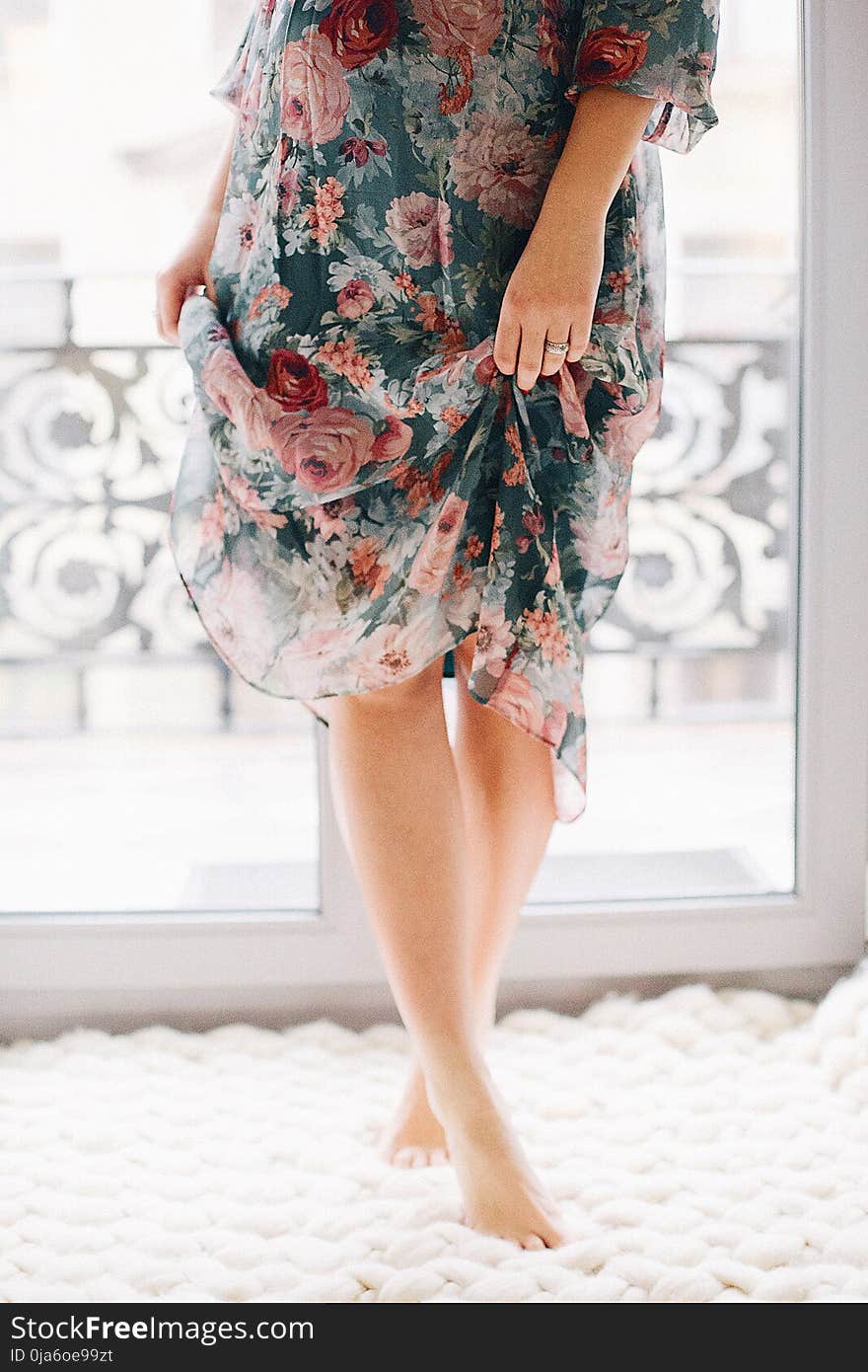 Woman Wearing Blue and Brown Floral Dress