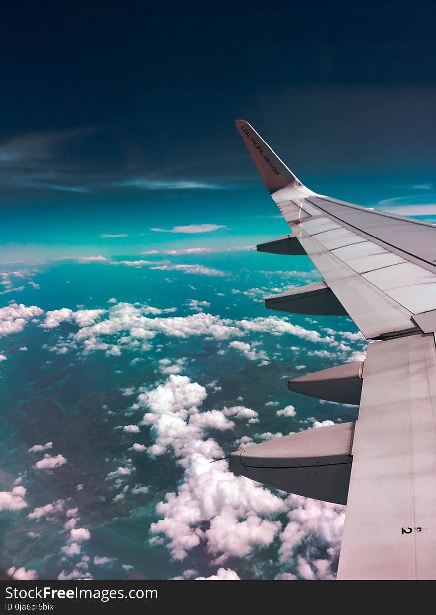 Airplane Wing Towards Clouds