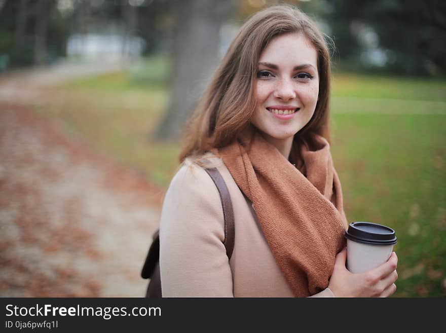 Woman Holding Disposable Cup