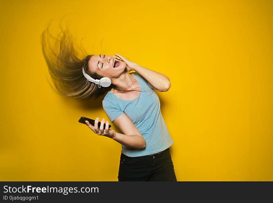 Photography of Woman Listening to Music