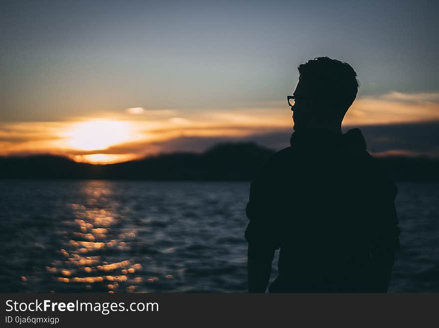 Silhouette of Man during Sunrise