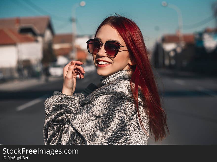 Close-up Photography of a Woman in the middle of the Road