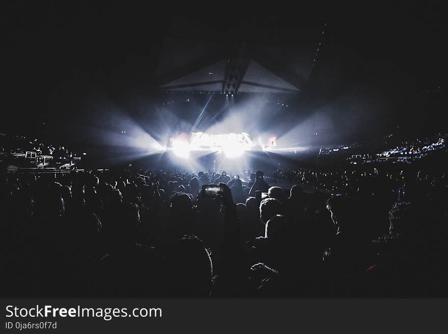 Crowd Watching Show Inside the Dark Stadium