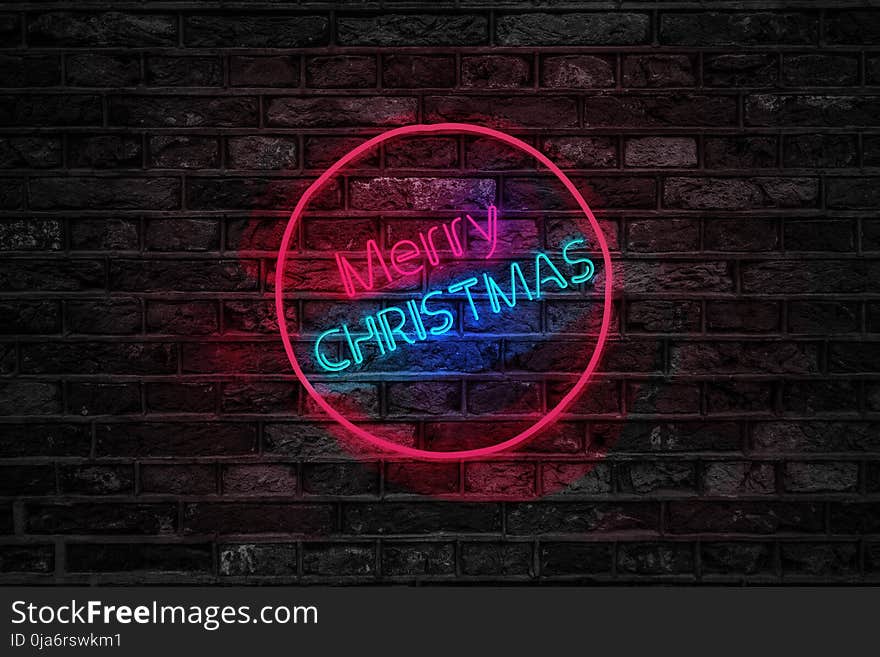 Turned on Red and Blue Merry Christmas Neon Sign