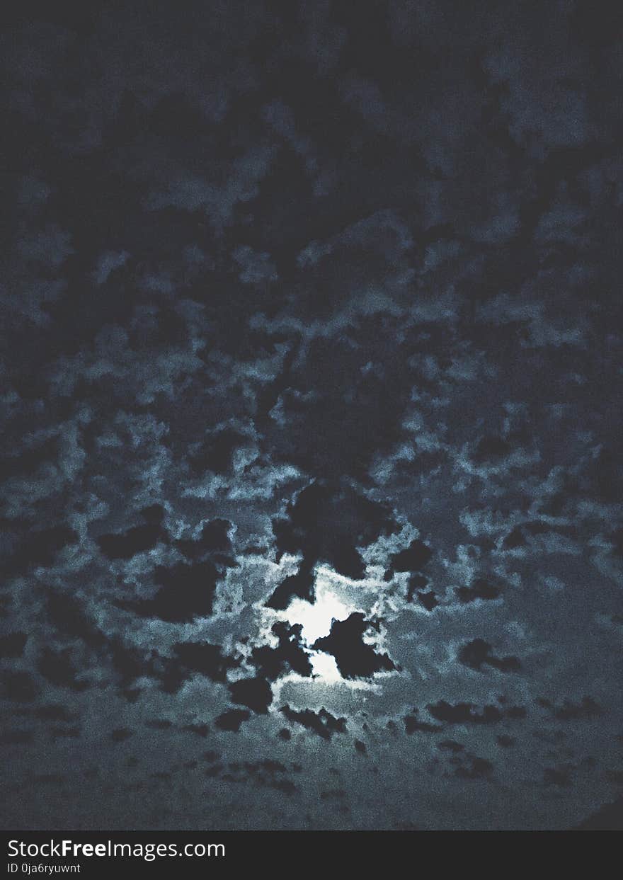 Moon Surrounded By Clouds