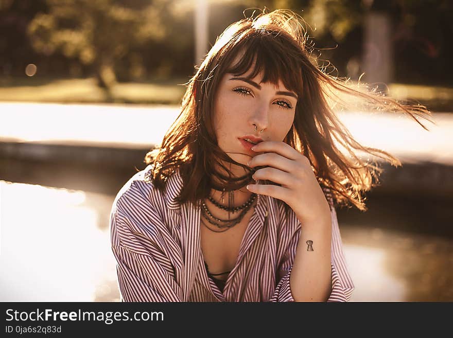 Woman in Red and White Stripes Top Photo