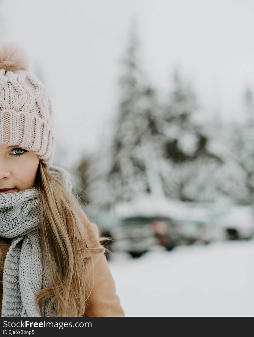 Girl Wearing Winter Outfit on Snowy Field