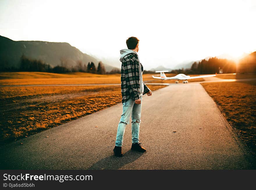 Photography of a Man Wearing Gray Jacket Looking Back