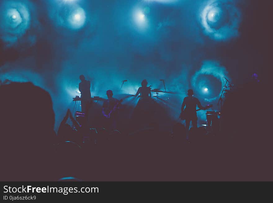 Music Band Performs on Stage during Nighttime