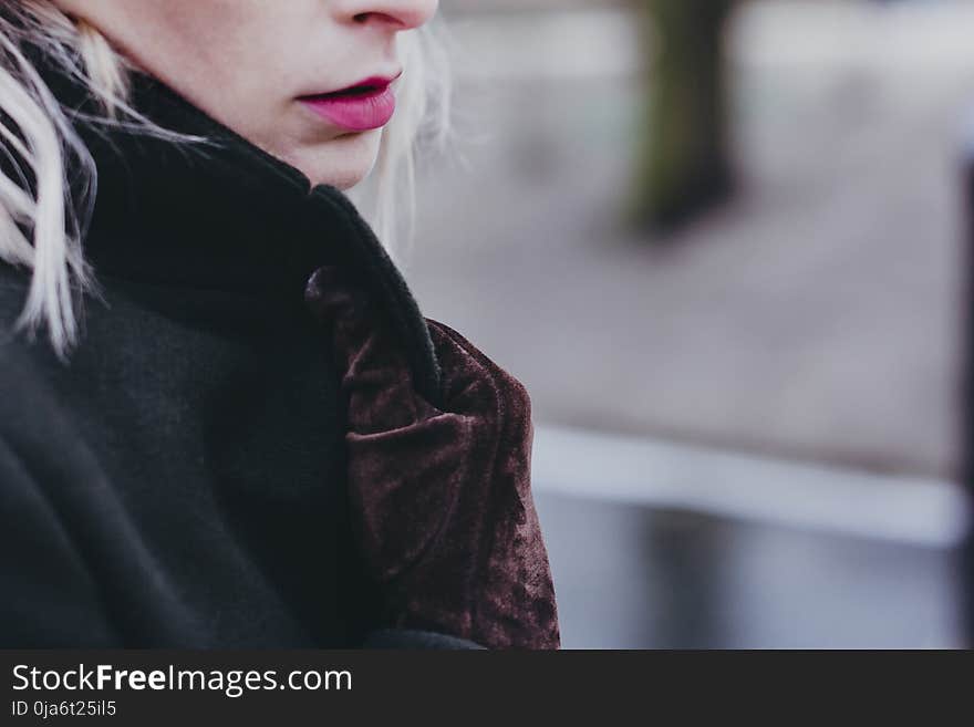 Woman Wearing Brown Suede Gloves Holding Her Coat