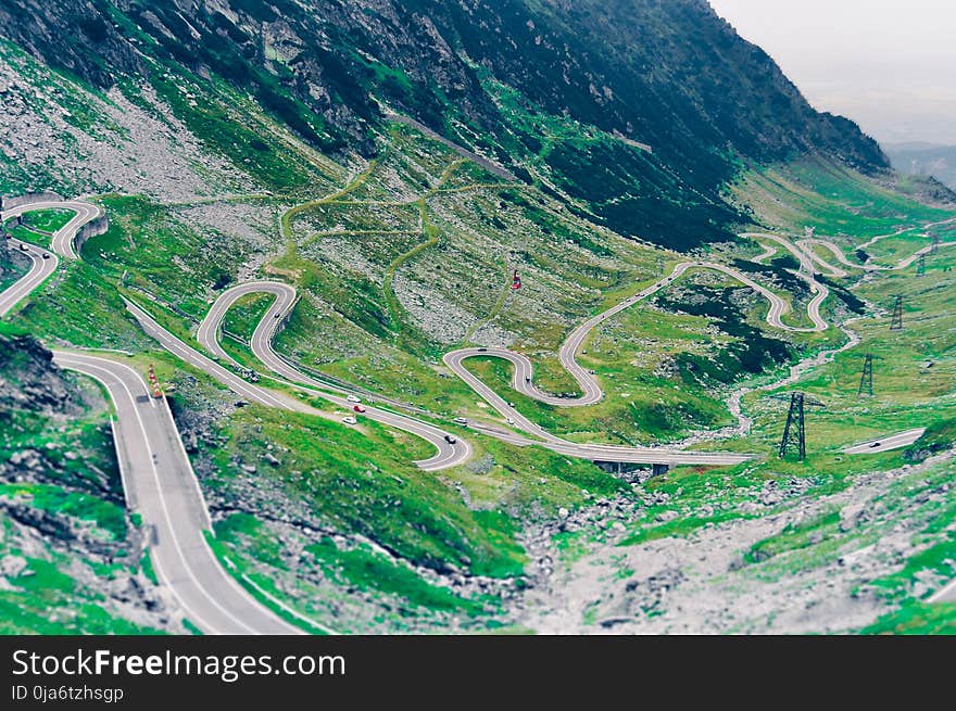 Aerial Photo of Green Scenery and Winding Road