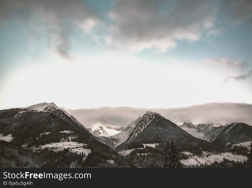 Gray Mountain at Daytime Under Gray Sky