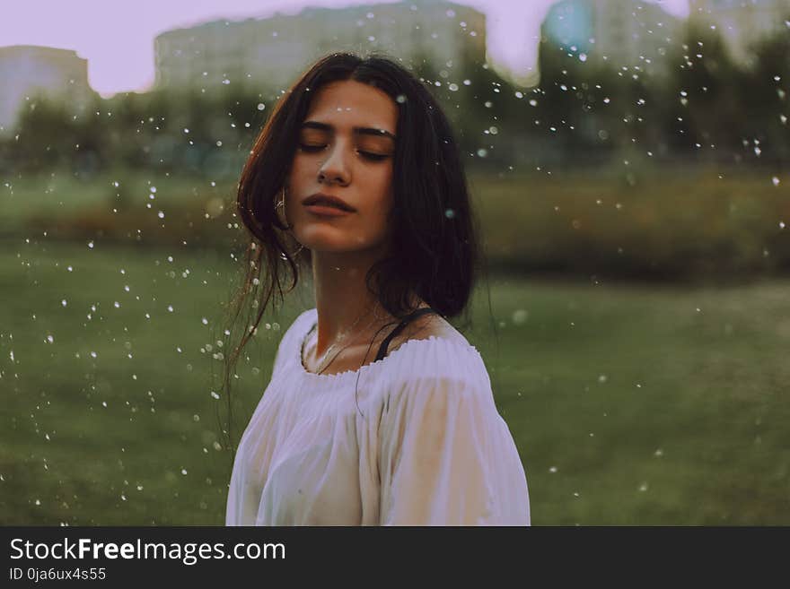 Woman in White Shirt With Green Background