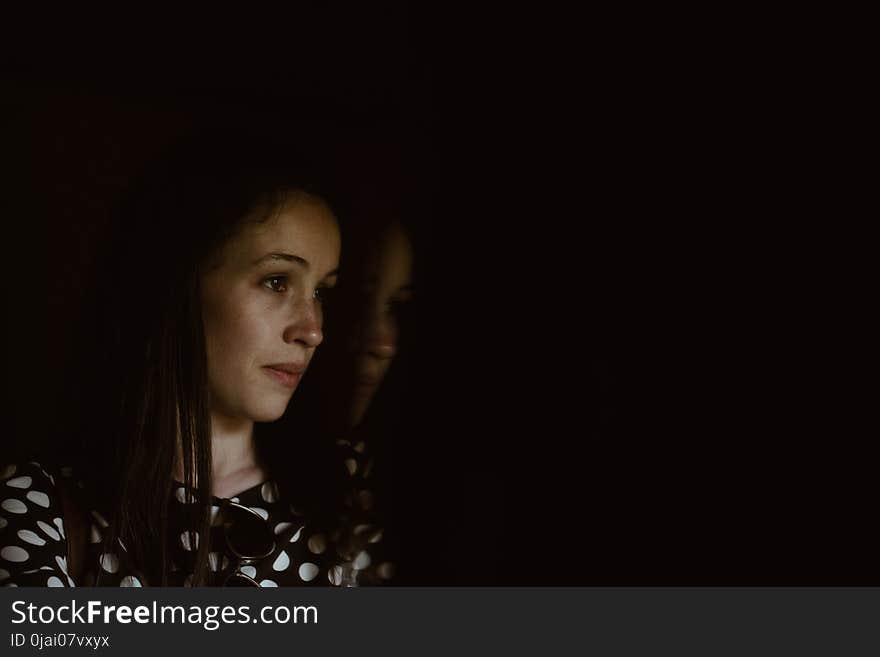 Woman Wearing Black and White Polka-dot Shirt