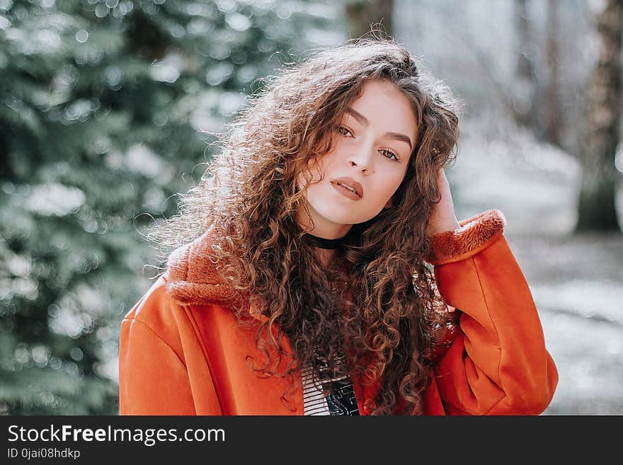 Woman in Orange Zip-up Jacket