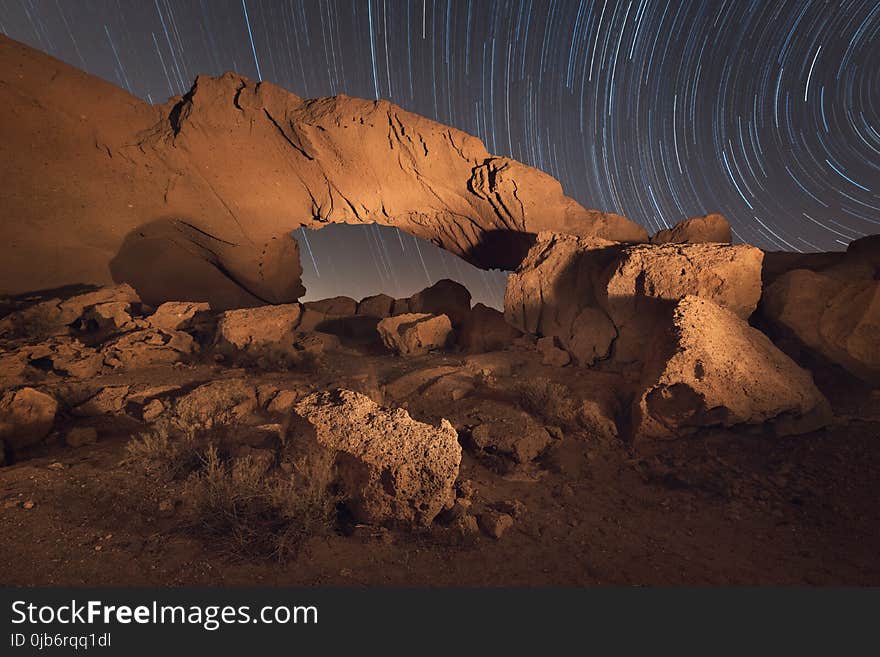 Star trails night landscape of a volcanic Rock arch in Tenerife, Canary island, Spain.