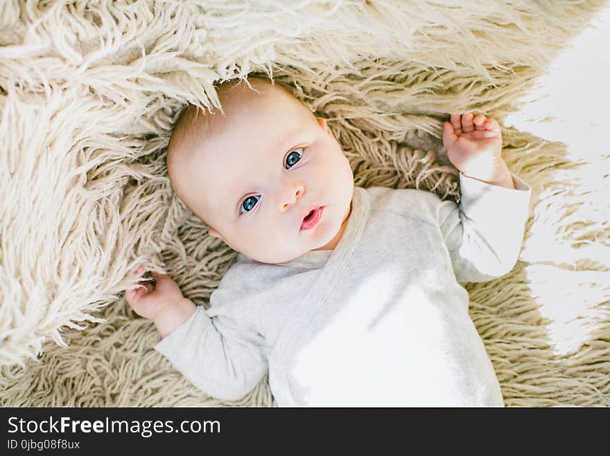 Baby in White Onesie