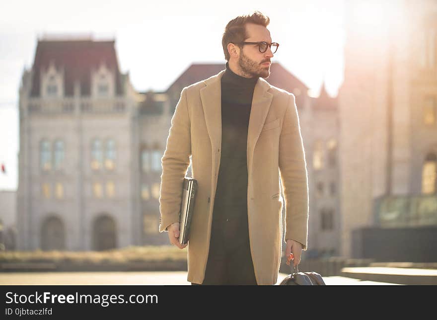 Man Wearing Brown Coat