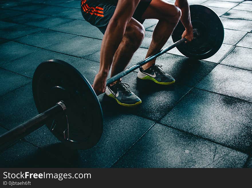 Person Holding Barbell