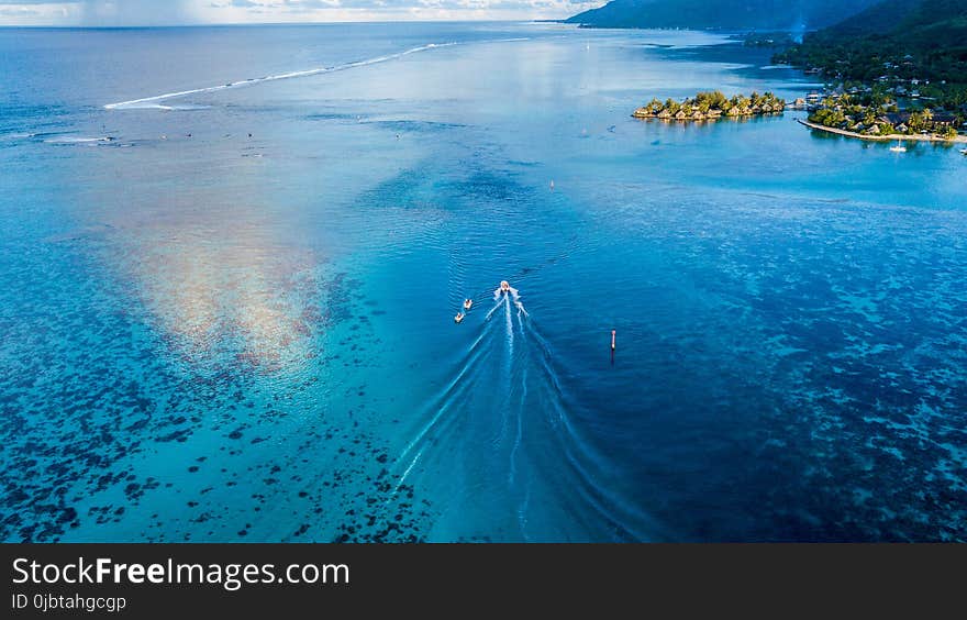 Boat Sailing Towards With Blue Calm Body of Water