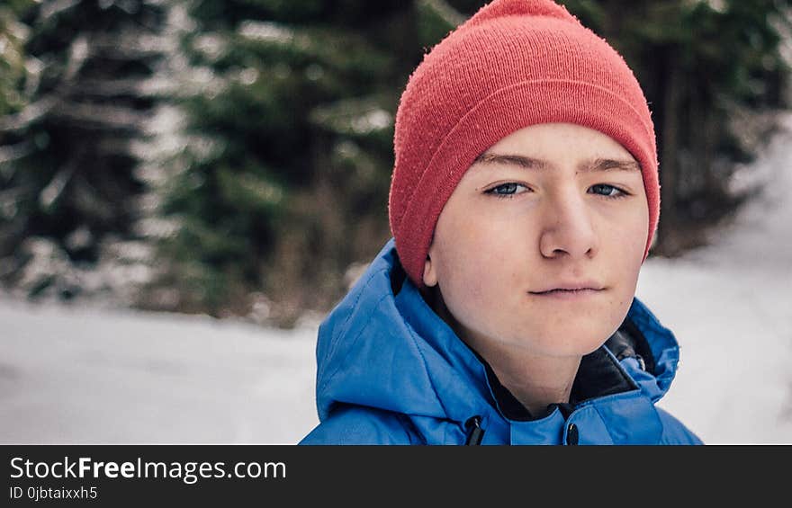 Man in Blue Hoodie Jacket With Red Beanie