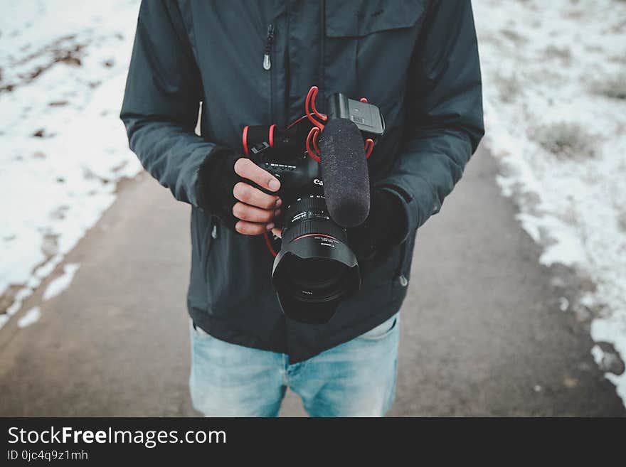 Man Holding Dslr Camera