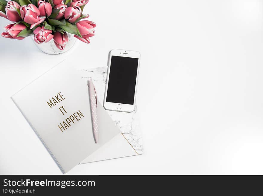 Silver Iphone 6 Beside Click Pen and Card