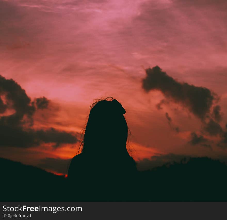 Silhouette of a Woman During Dawn