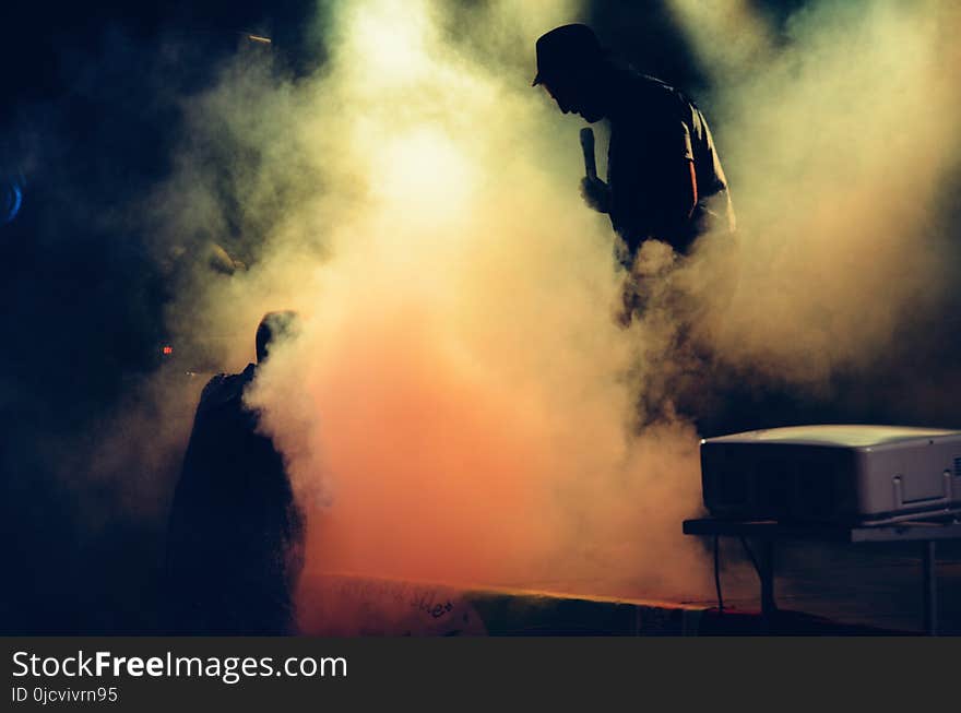 Man Holding Microphone at the Stage