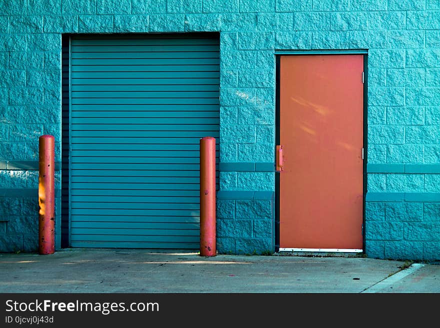 Brown Panel Door Near Roll-up Gate