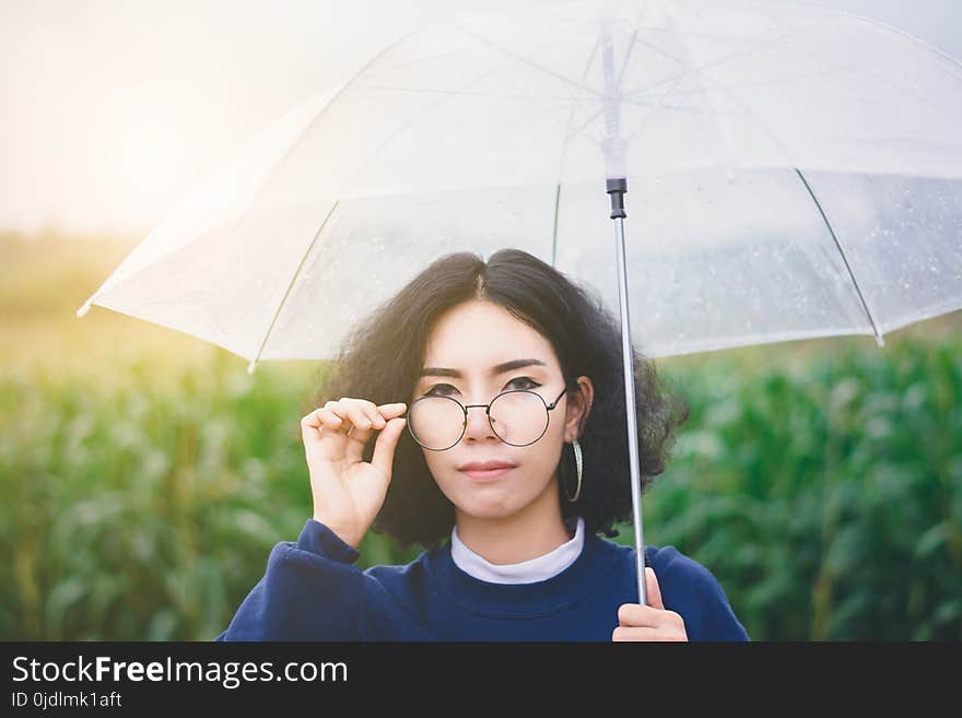 Portrait of beautiful Asian woman enjoy natural outdoor at corn