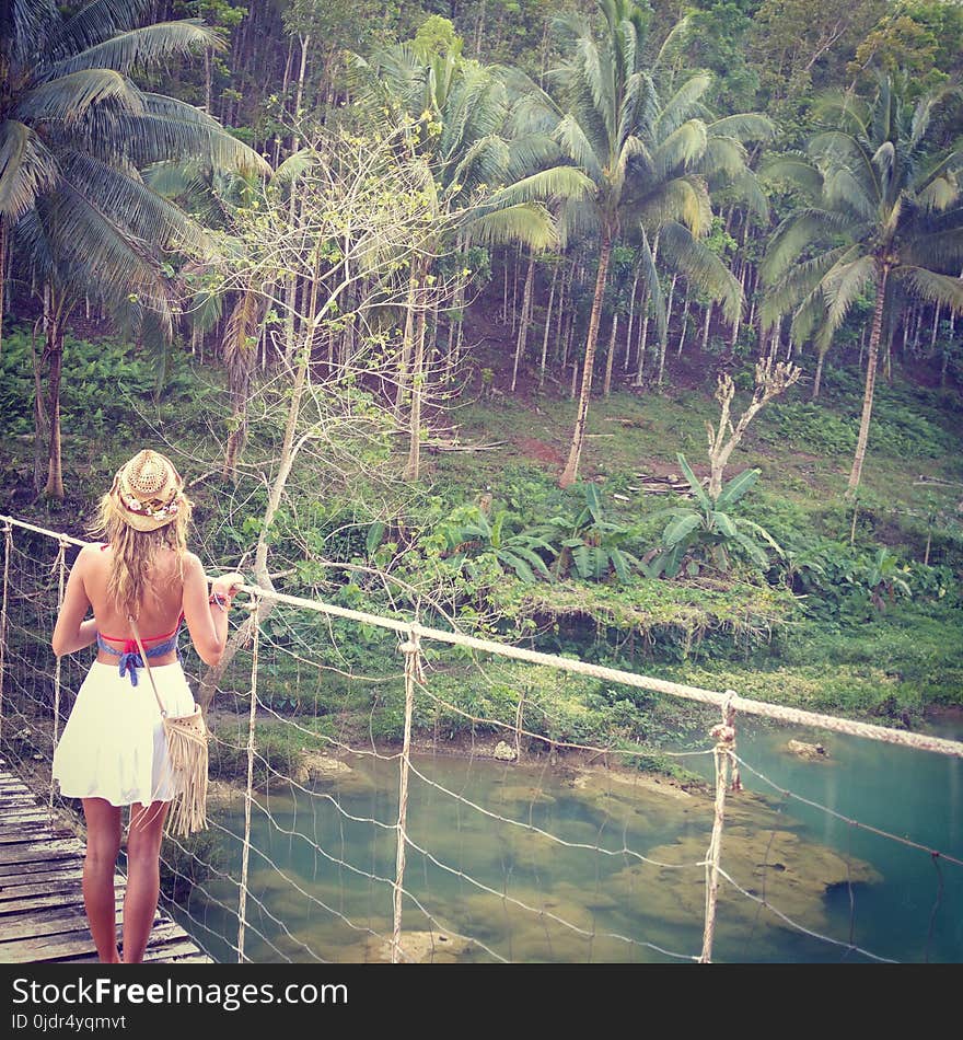 The girl is standing on a Caribbean island. Carenero, Bocas del Toro, Panama