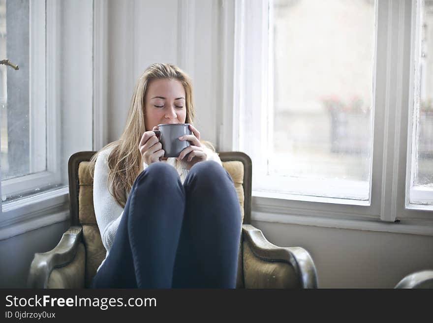 Woman Holding Gray Ceramic Mug