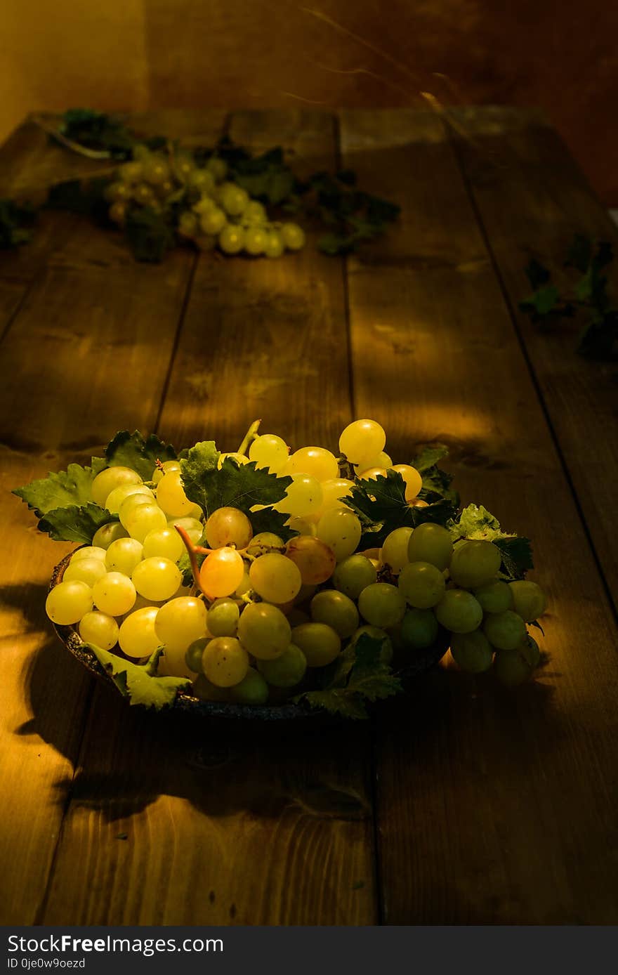 White Grapes On Wooden Plane