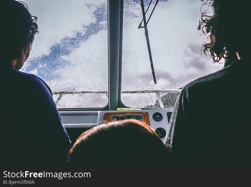 Two Person Facing in Front of the Glass