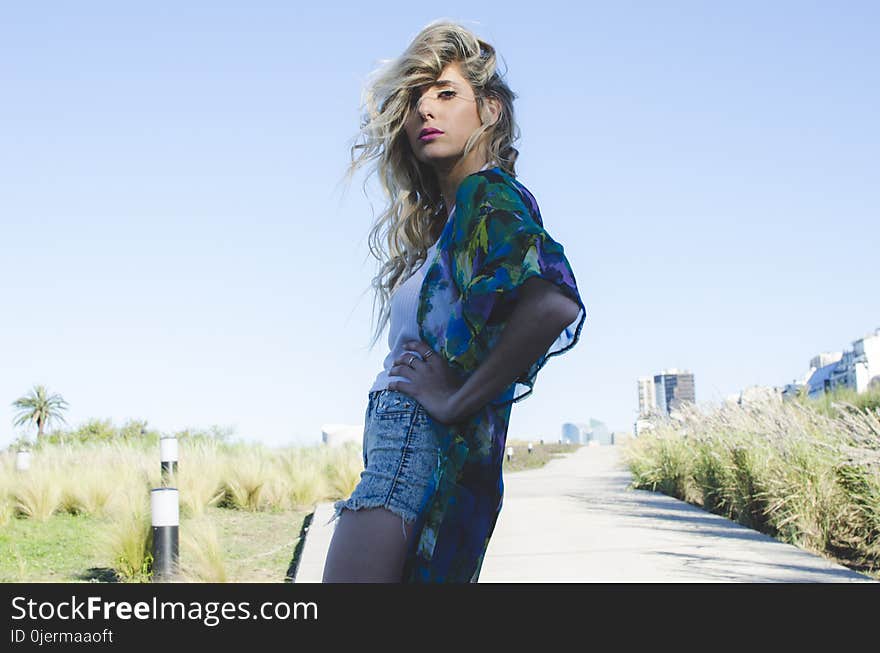 Woman in Green and Blue Cardigan