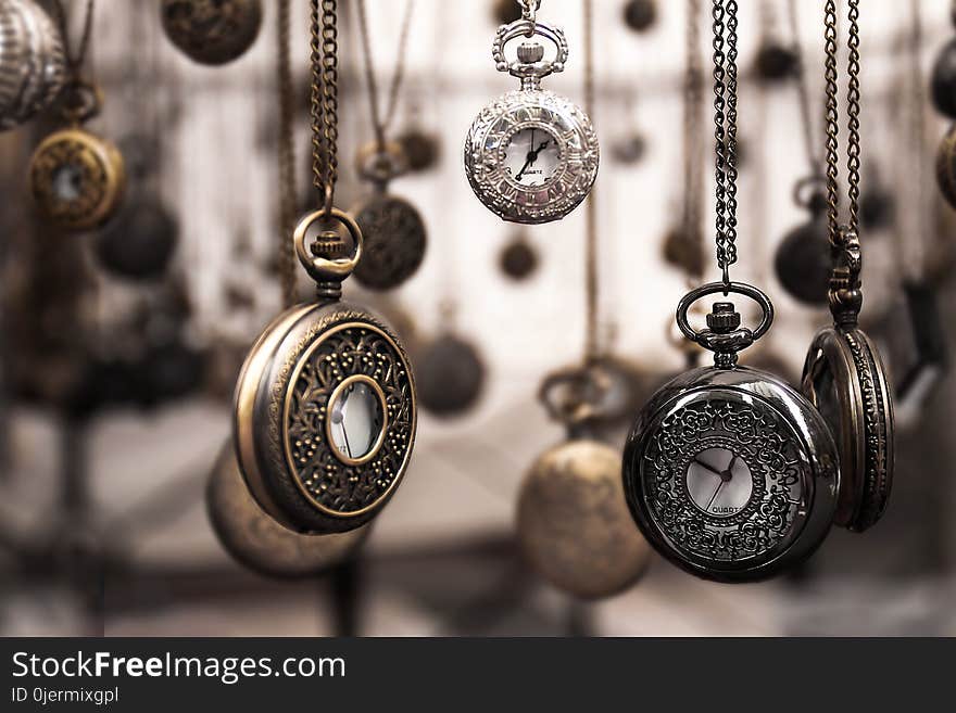 Assorted Silver-colored Pocket Watch Lot Selective Focus Photo