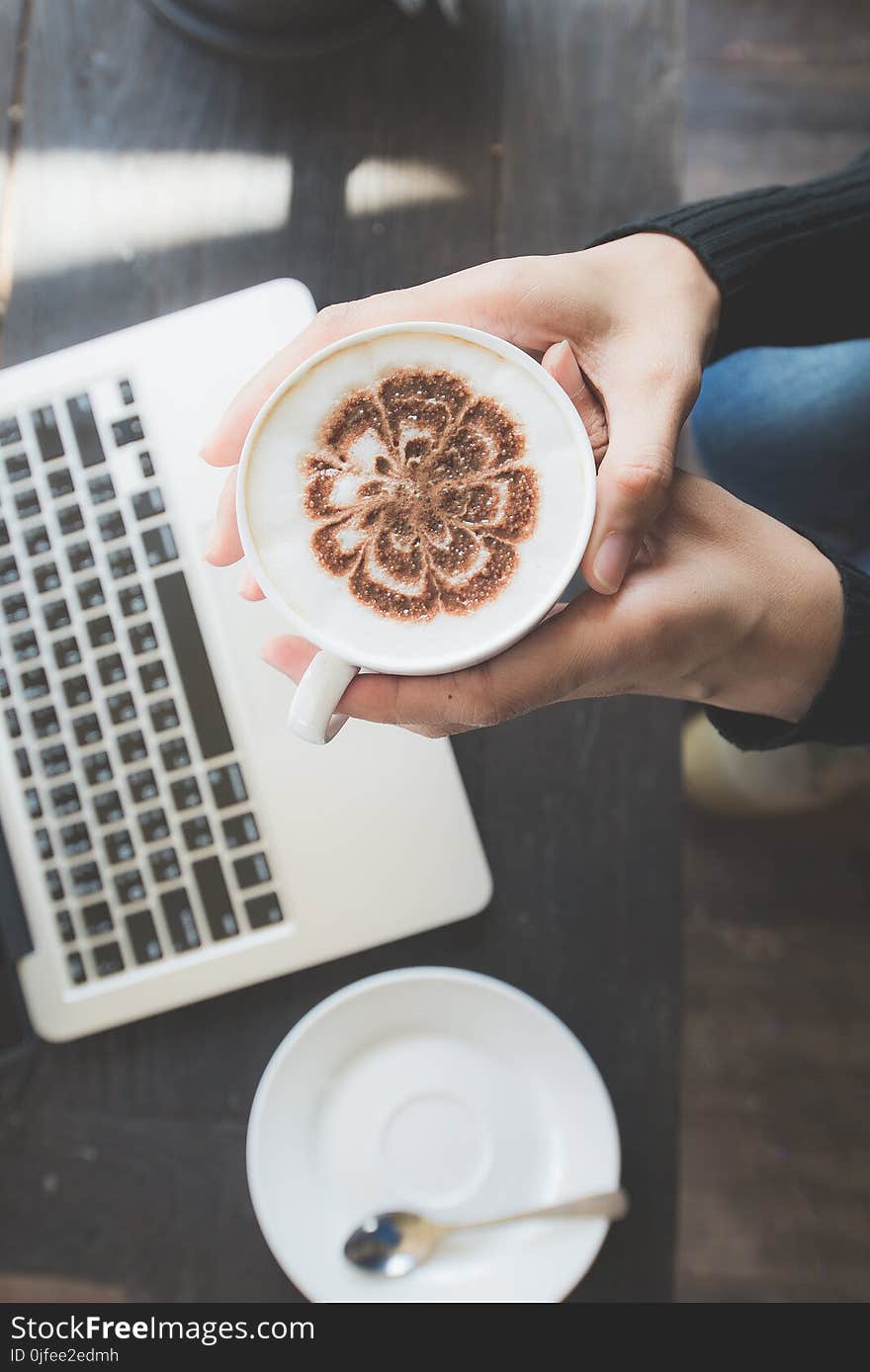 Young Woman Drinking Coffee