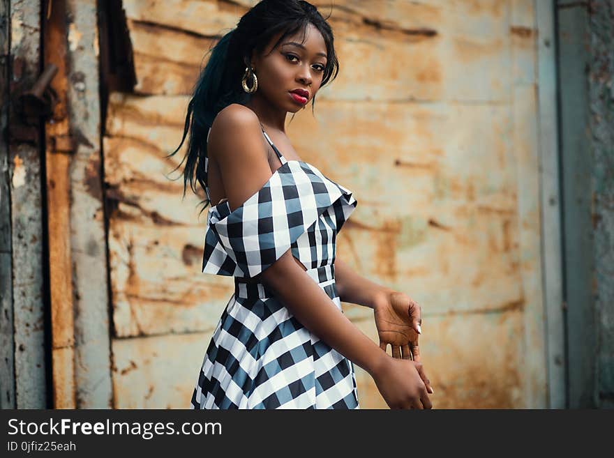 Woman Wearing White and Black Plaid Cold-shoulder Dress