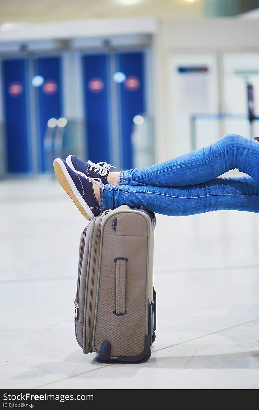 Woman in international airport waiting for her flight