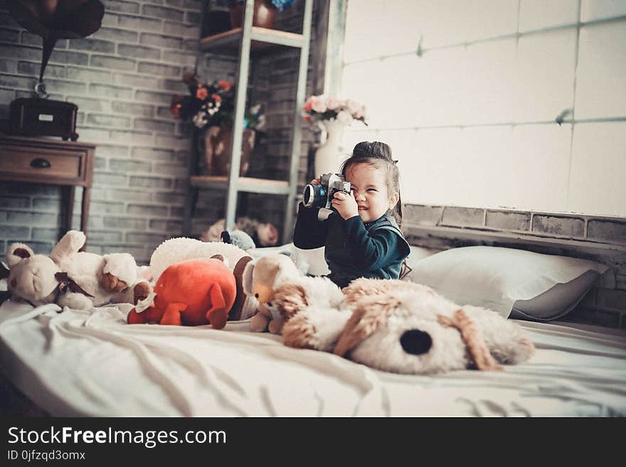 Photo of a Girl Playing With the Camera