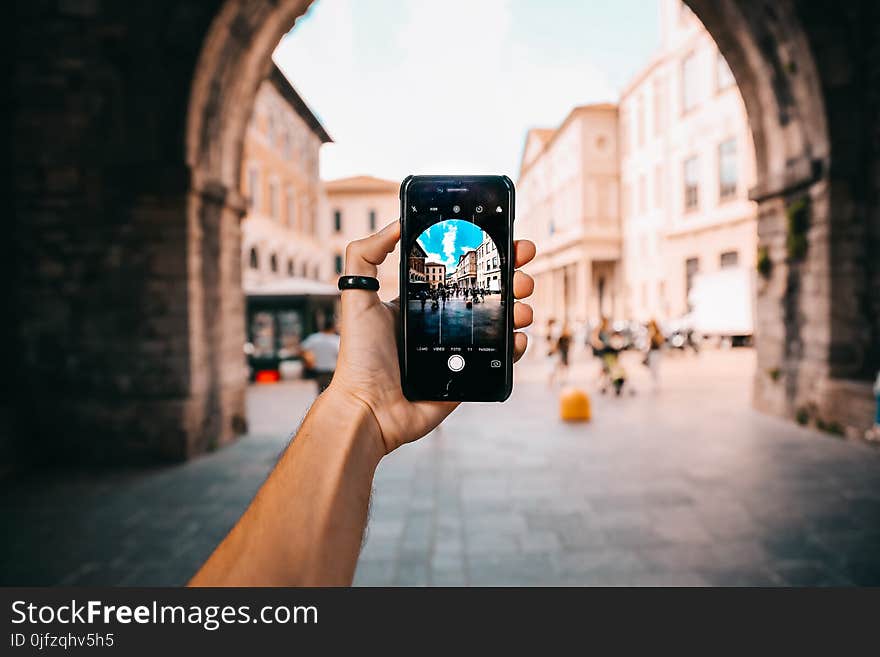 Person Holding Black Android Smartphone