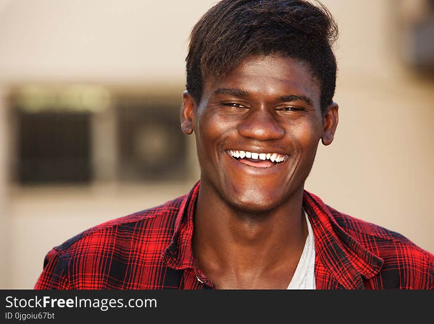 Close up portrait of handsome young man laughing. Close up portrait of handsome young man laughing