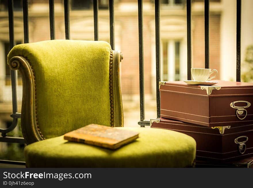 Yellow Book on Green Ottoman