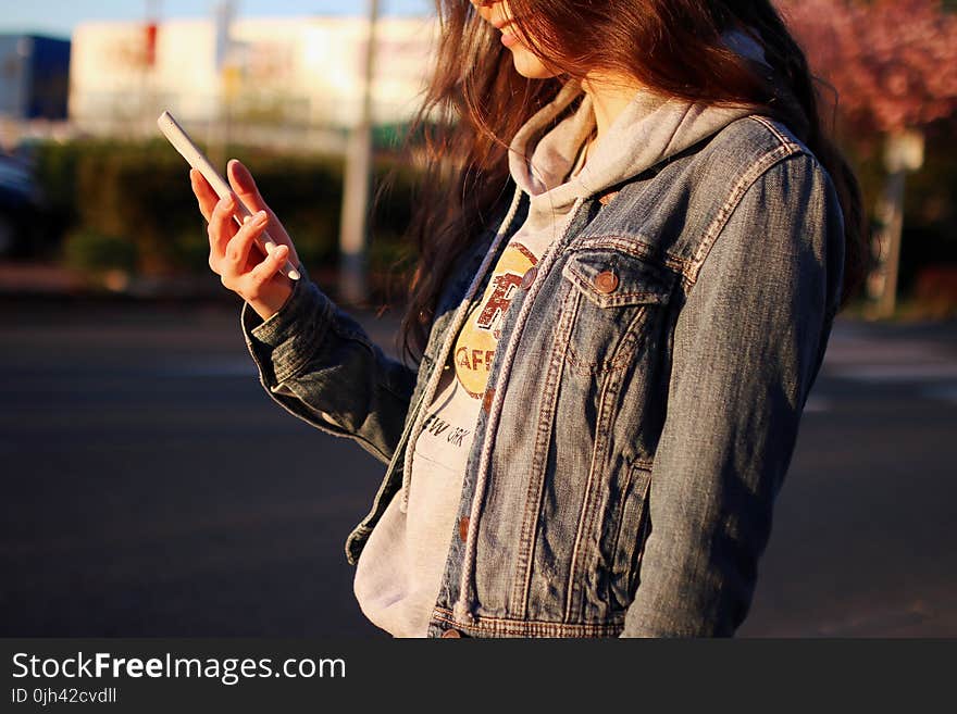 Woman in Blue Denim Jacket Daytime Photography