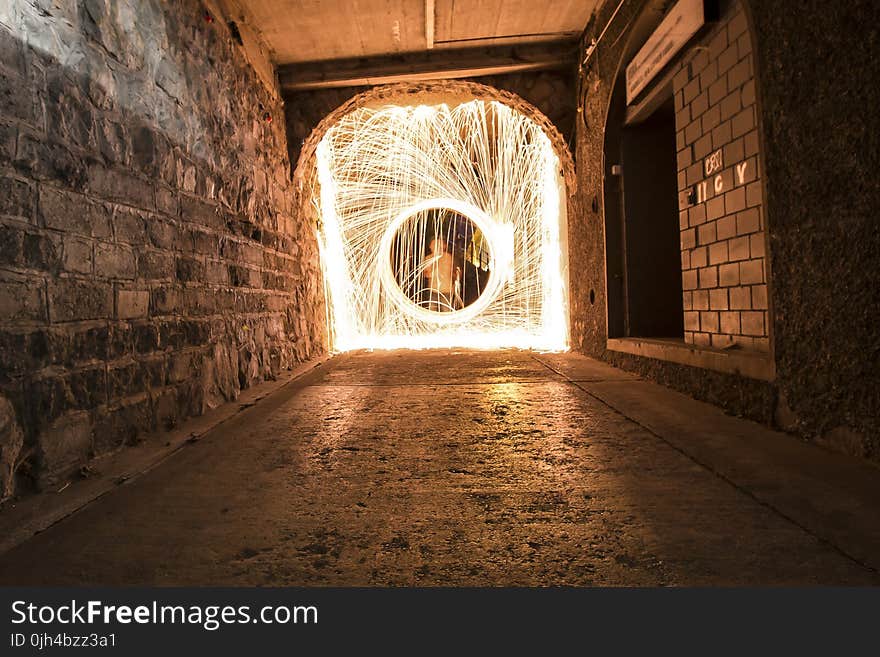 Timelapse Photo of Man in Hallway With Light