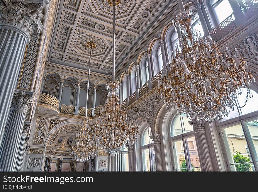 White Cathedral Hanging With Three Brown Uplight Chandelier