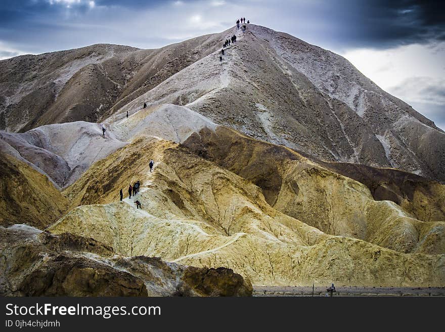 Landscape Photo of Mountain Under Blue Clear and White Cloudy Sky